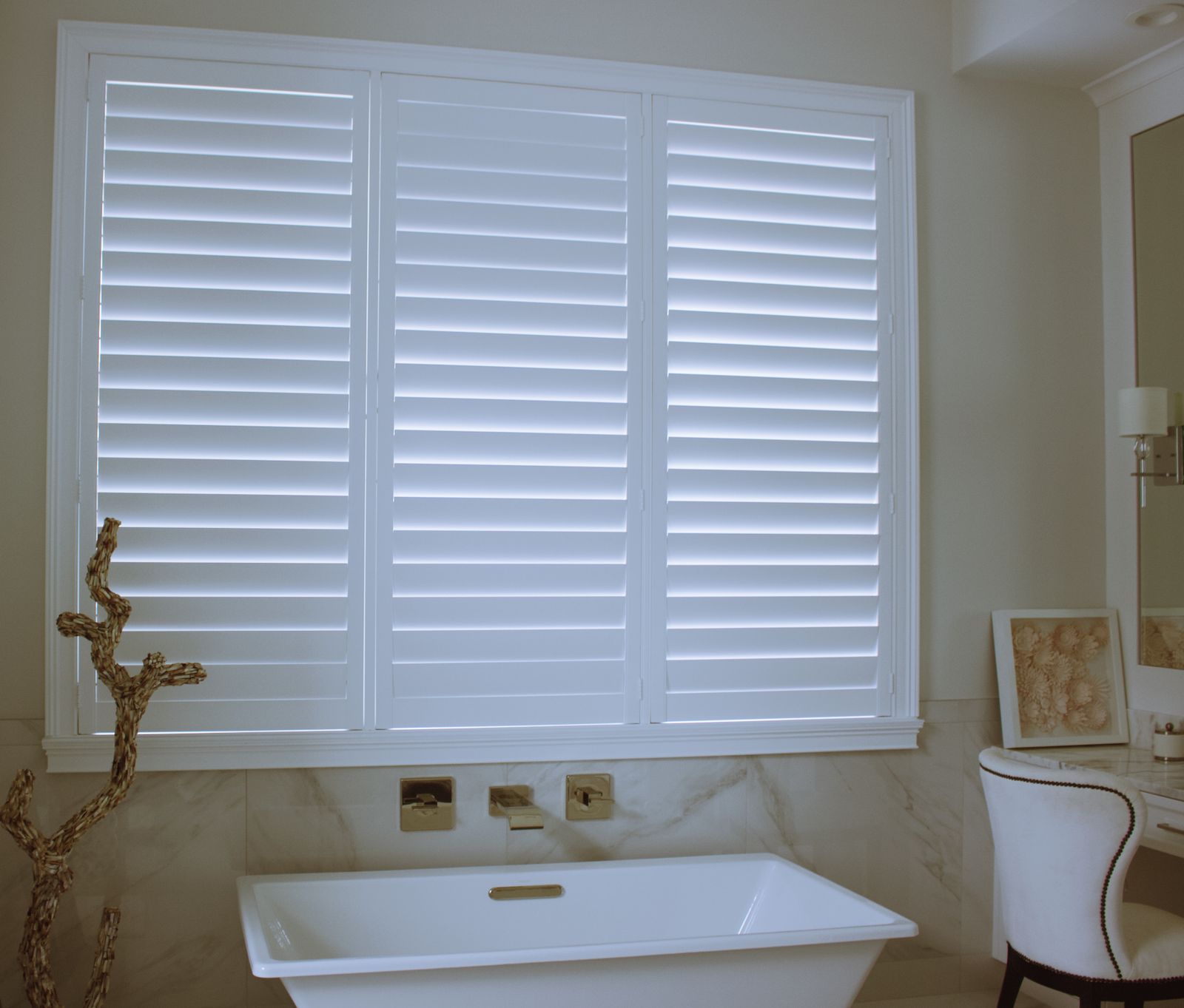 White California shutters across a sunlit interior