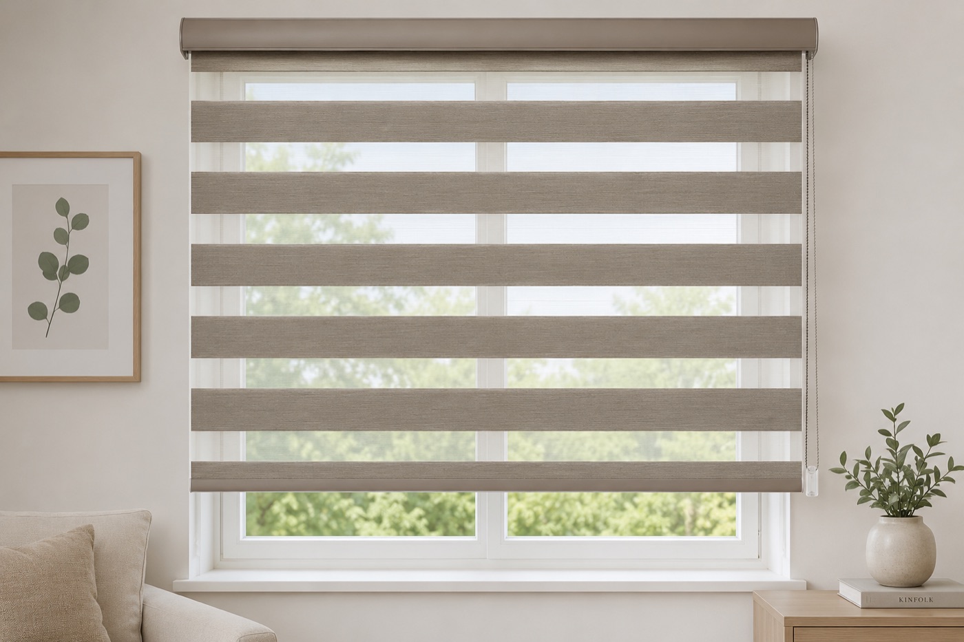A calm living room with zebra blinds dressing a wide window, framed botanical art beside